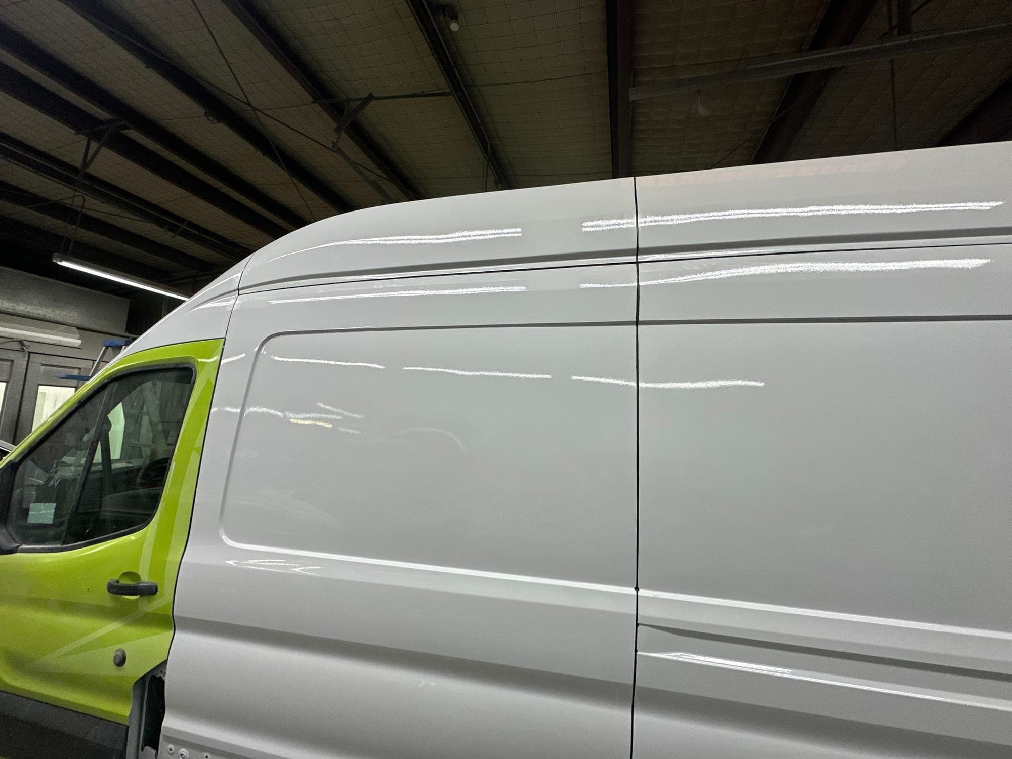 Cargo van, side panel: after repair. The cargo van panel after repair and paint, ready for the wrap
