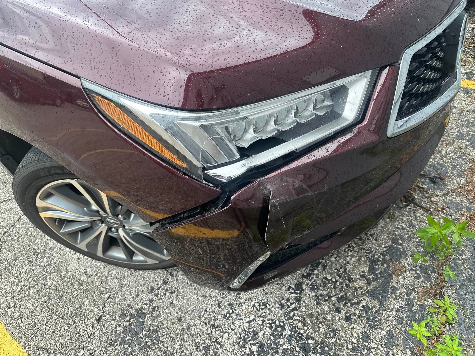 SUV, front corner: before repair. A dark red SUV with front corner damage and a displaced headlight